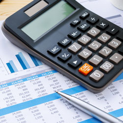 Financial Document With Calculator and Pen